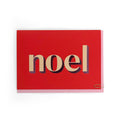 Noel Christmas card with cream and pink foiled typography on a red background