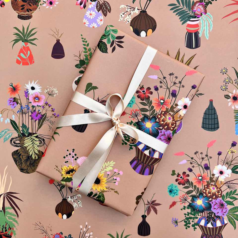Objet wrapping paper with wrapped gift and illustrated floral vase design