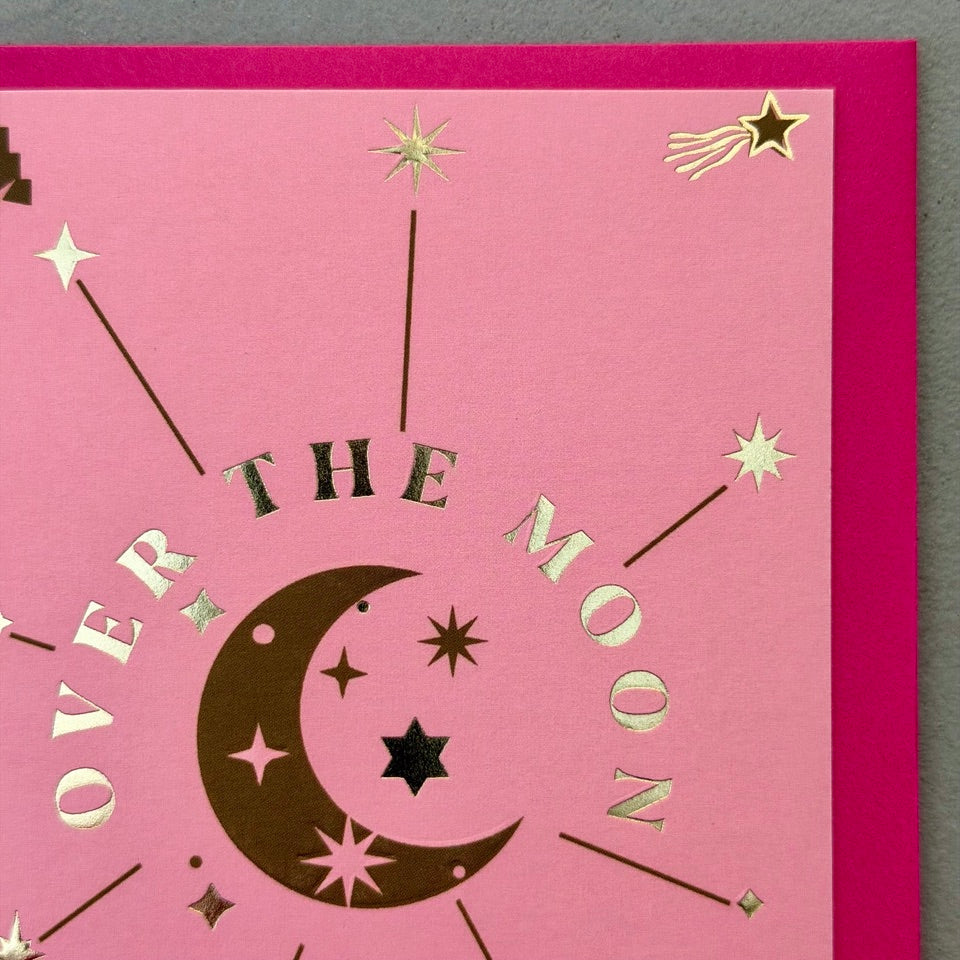 Close-up of the Over the Moon You're a Star design highlighting the crescent moon, metallic gold foil lettering and celestial details.
