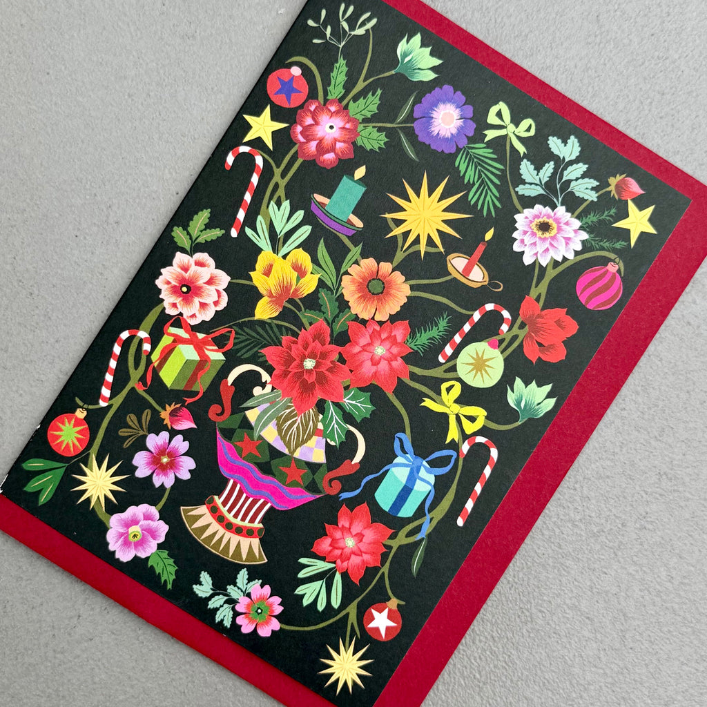 Angled view of Painted Garden Christmas card by PAVILION with red envelope