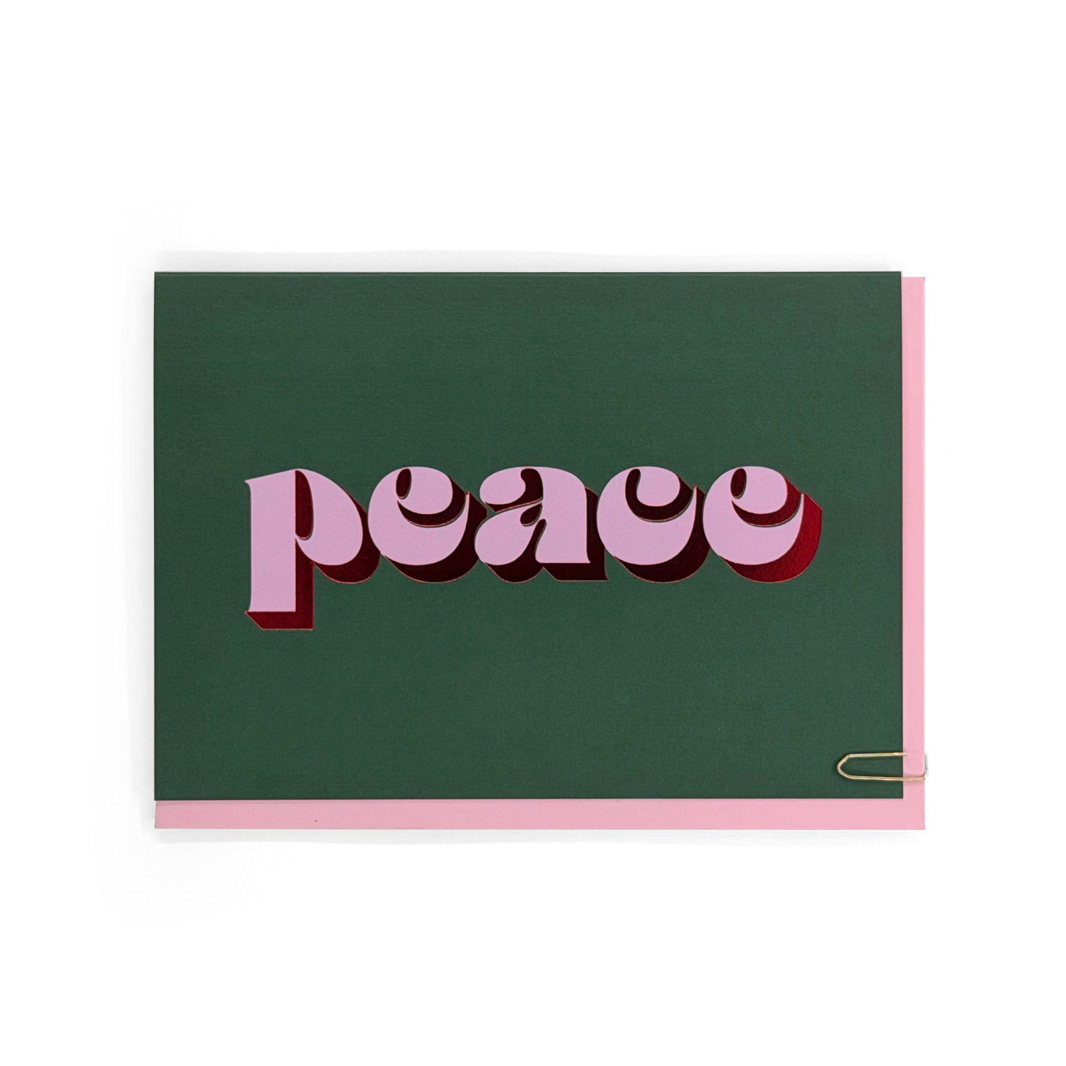 Peace Christmas card with pink typography and red foil on a dark green background
