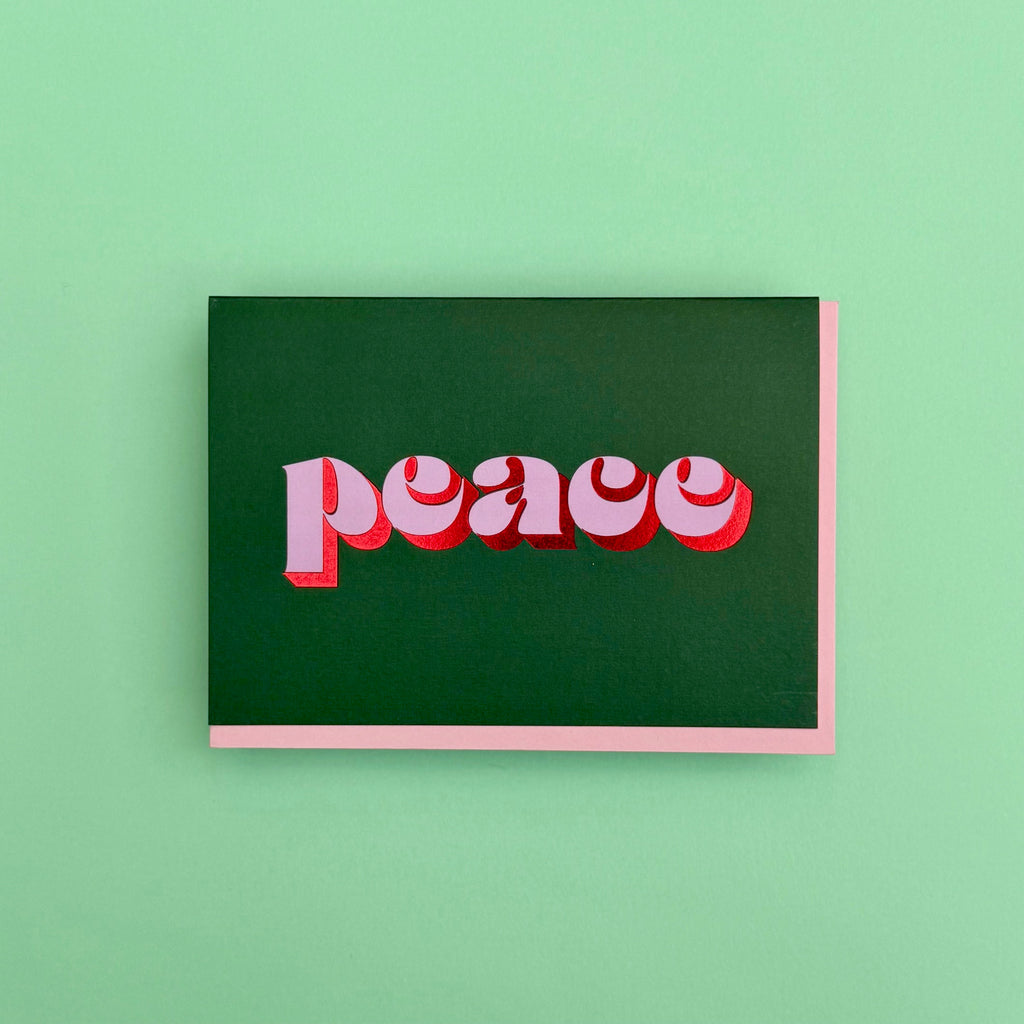 Peace Christmas card displayed against a green background