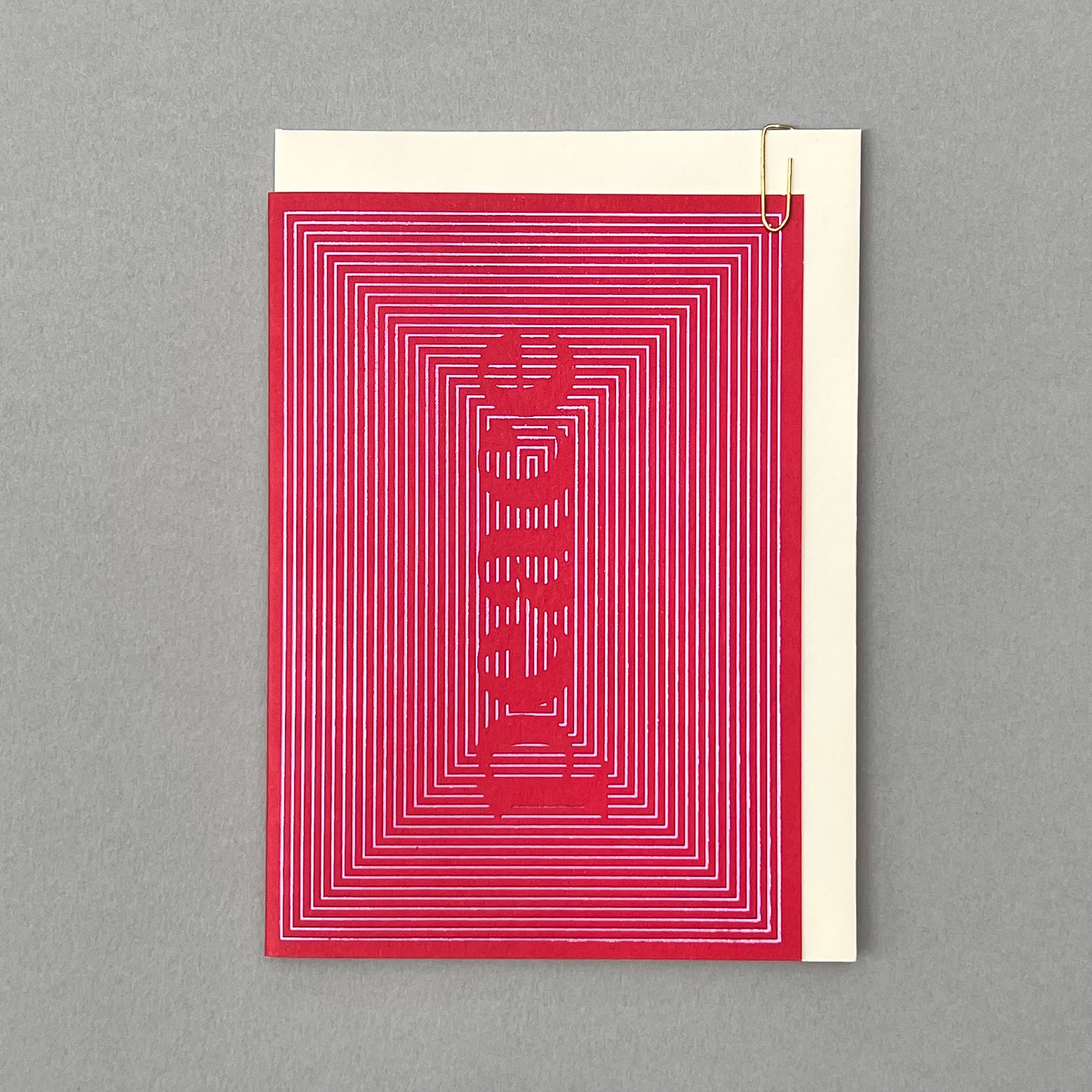 Peace Christmas card with cream envelope on a grey background