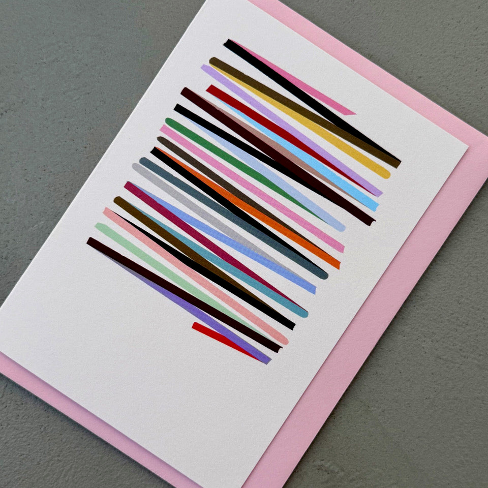 Angled view of the off-white Rhythm card with layered multicoloured lines
