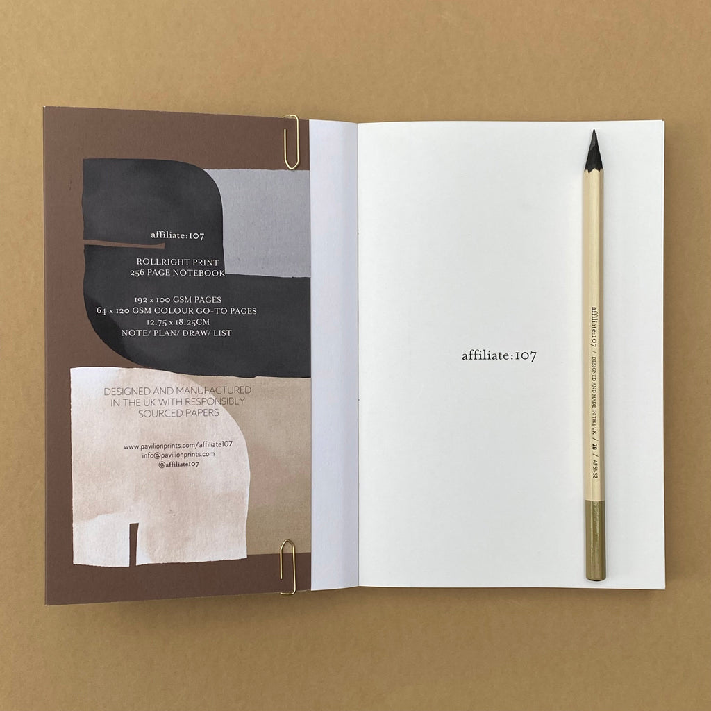 Rollright notebook open to inside cover and blank page with pencil