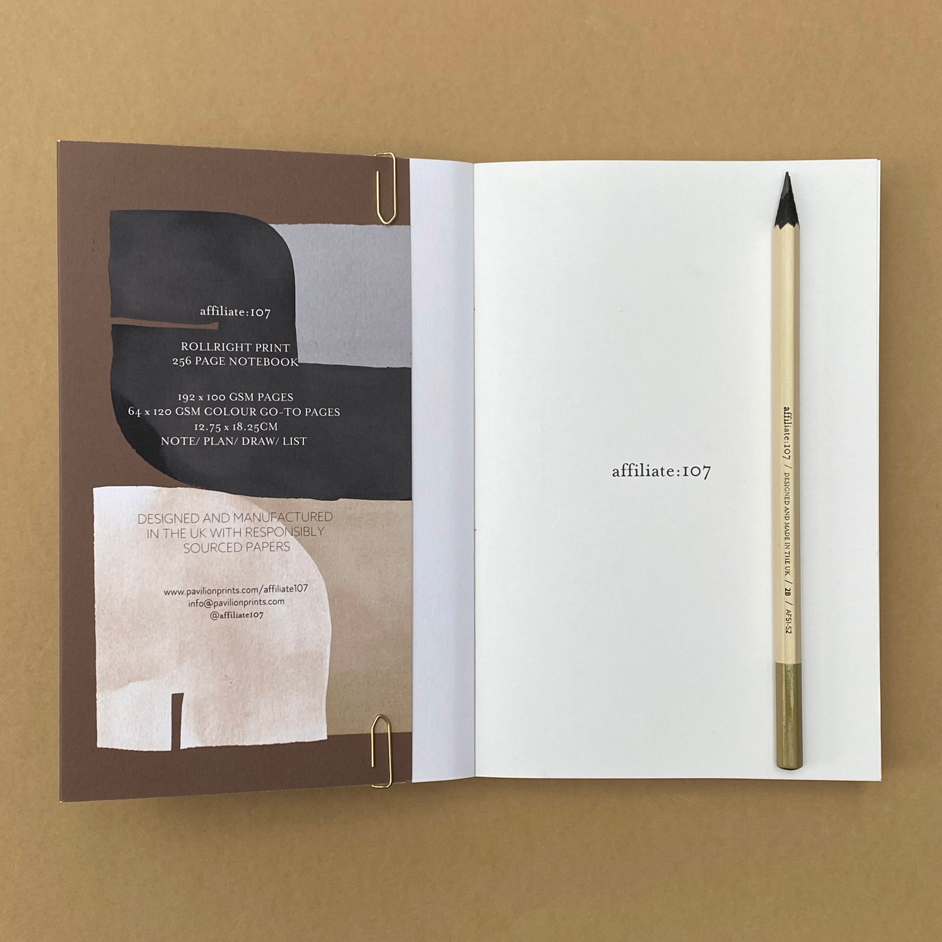 Rollright notebook open to inside cover and blank page with pencil