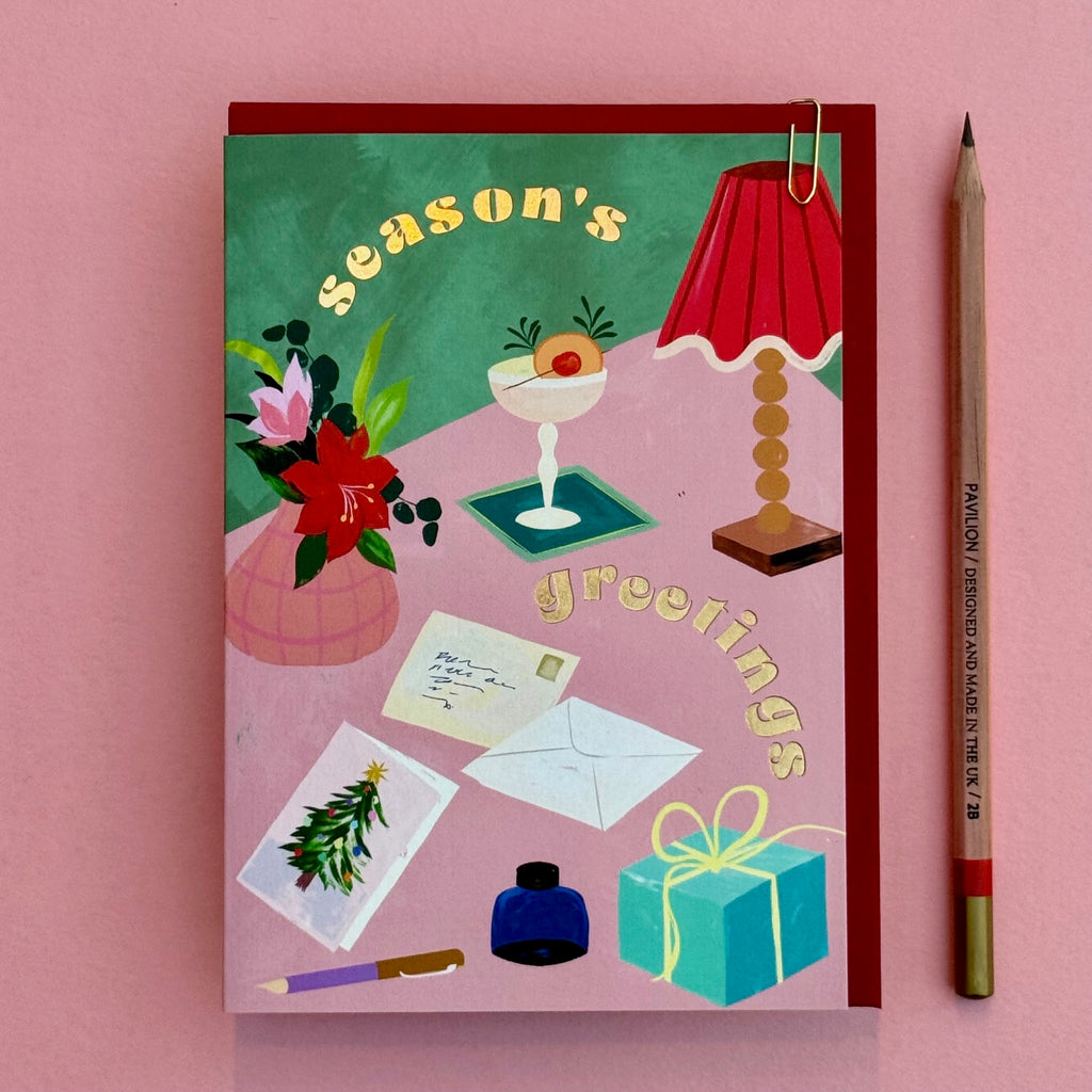 Season's Greetings Christmas card with pencil for scale