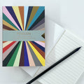 Spectrum A6 Notebook with multicoloured radiating stripe cover and lined pages