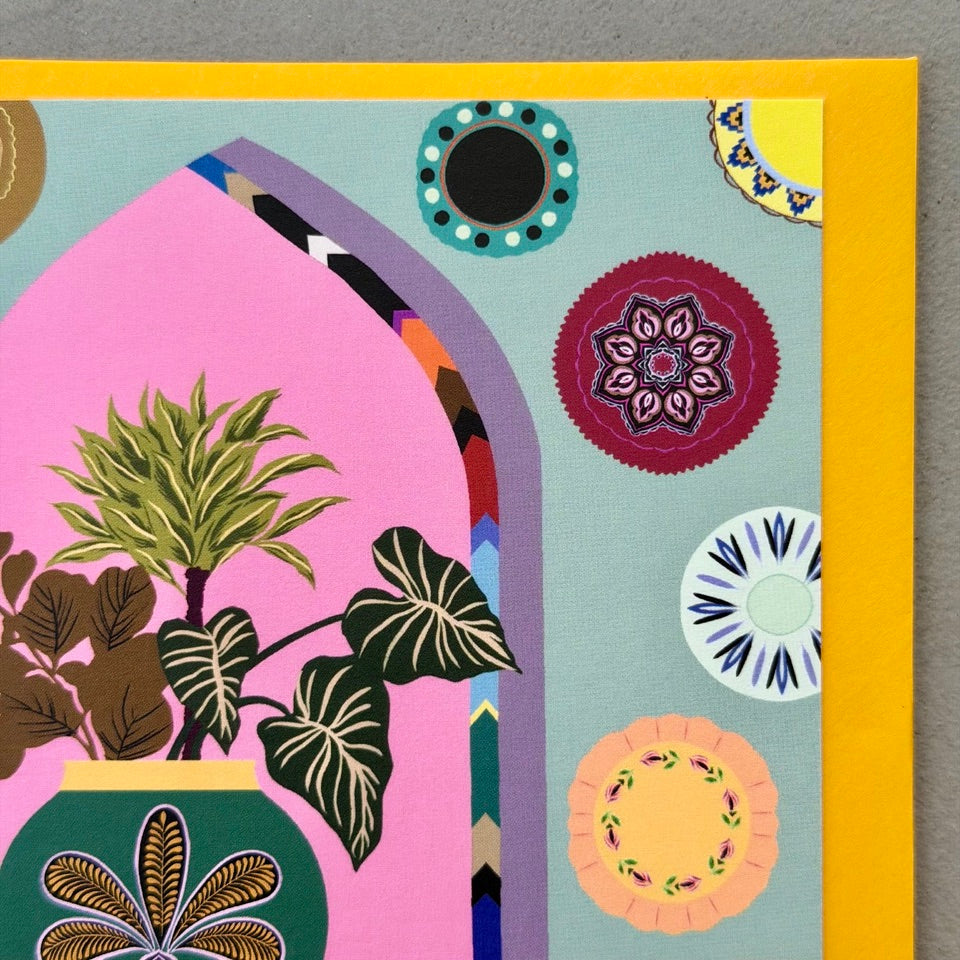 Close-up of the illustrated houseplants, decorative plates and patterned vase on the Styled Interior greeting card.