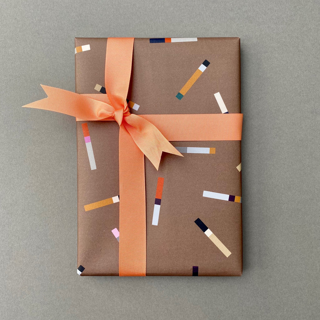 Wrapped gift in Tab wrapping paper with peach grosgrain ribbon