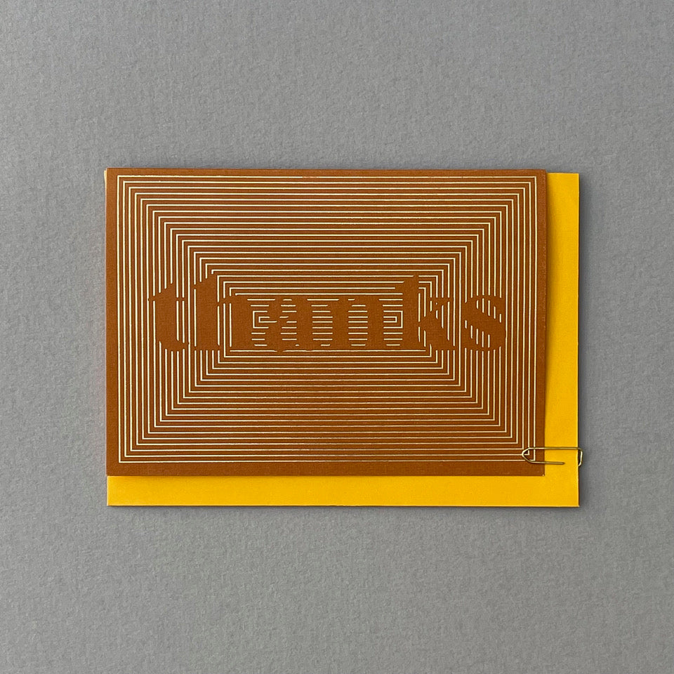 Thanks greeting card with yellow envelope on a grey background