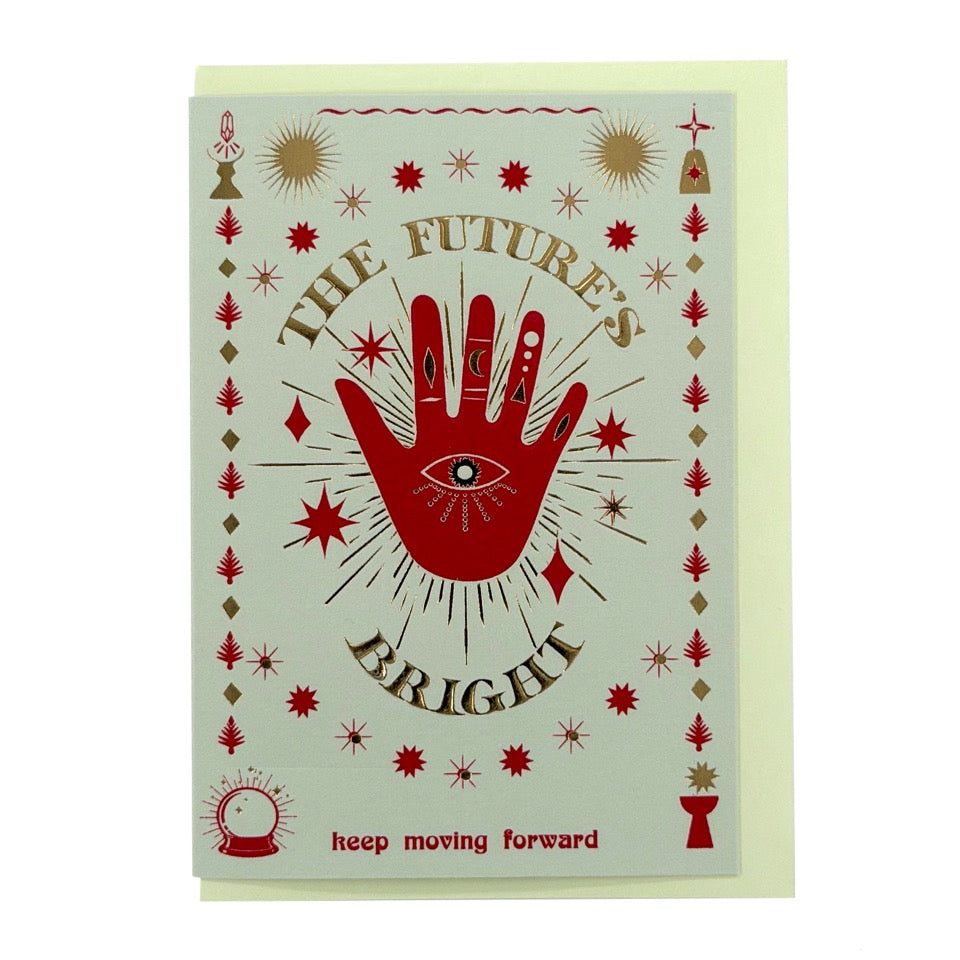 Foil-embellished greeting card featuring a symbolic red hand with the message "The Future's Bright" and mystical illustrations, paired with a pale mint envelope.