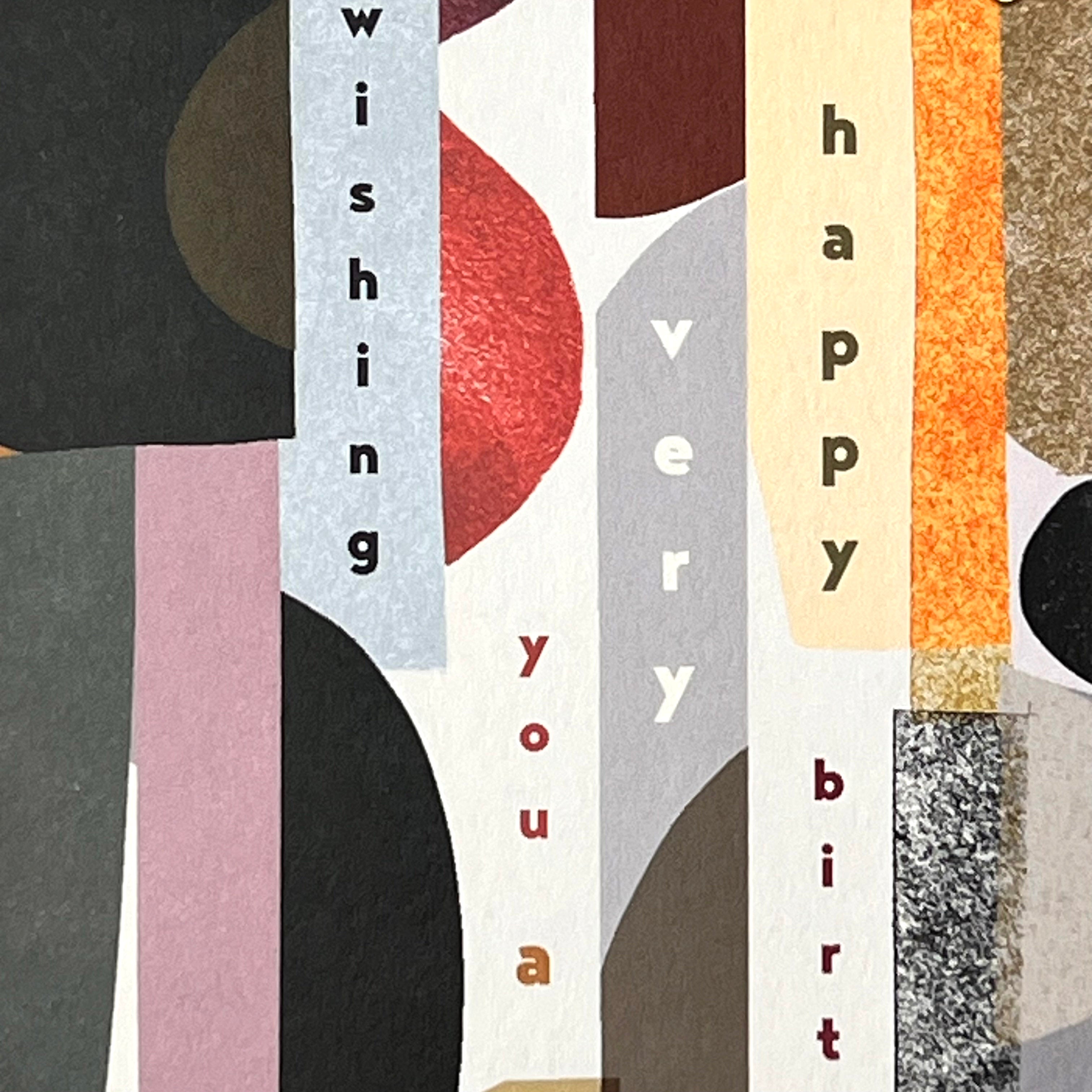 Close-up of the layered shapes and vertical Happy Birthday lettering