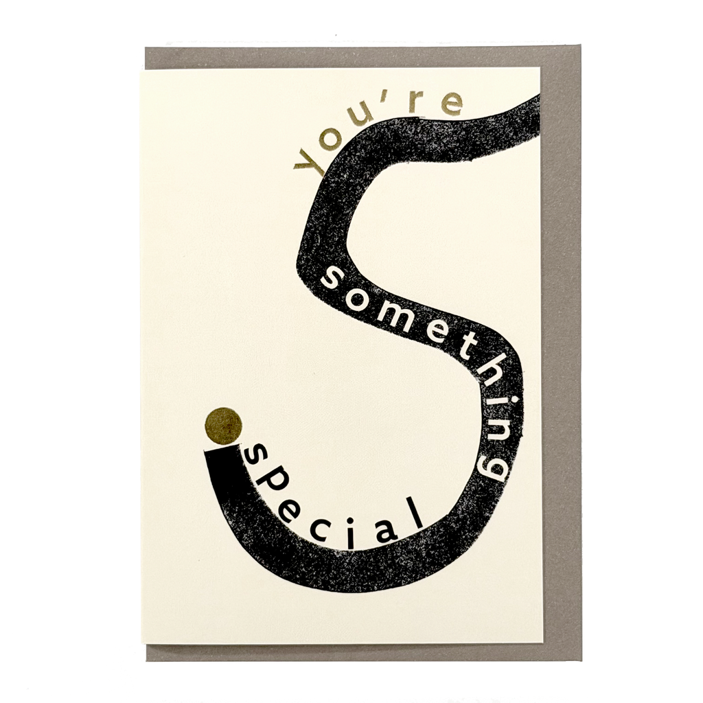 Front view of You’re Something Special card by PAVILION with graphic black lettering, gold foil details and grey envelope