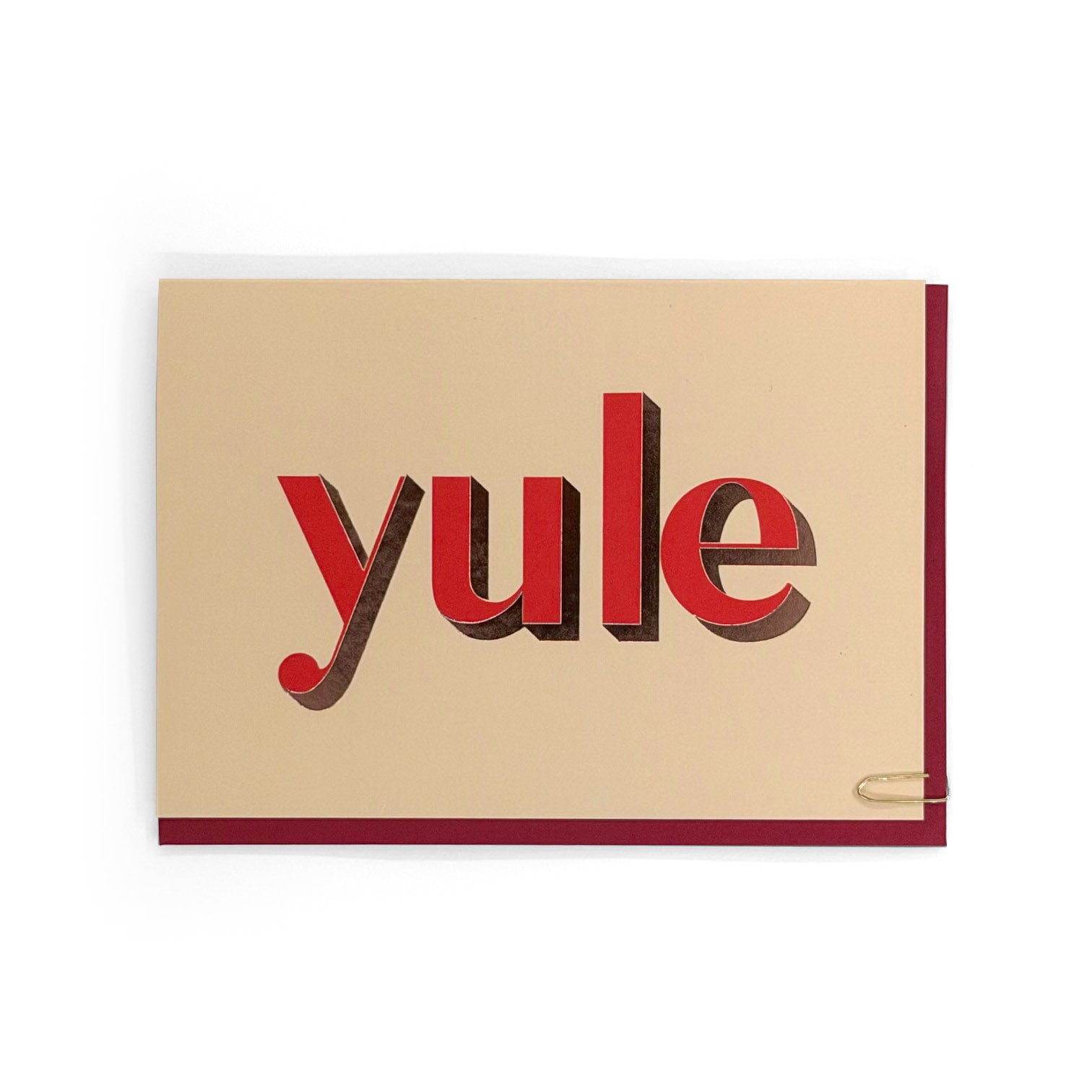 Yule Christmas card with red foiled typography on a cream background
